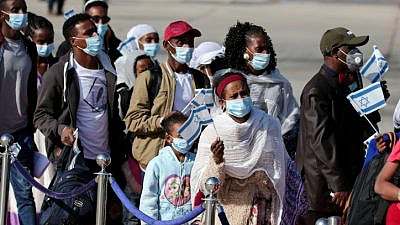 New immigrants to Israel from Ethiopia's Jewish community arrive at Ben-Gurion International Airport as part of “Operation Tzur Israel” (“Rock of Israel”) on Dec. 3, 2020. Photo by Miriam Alster/Flash90.