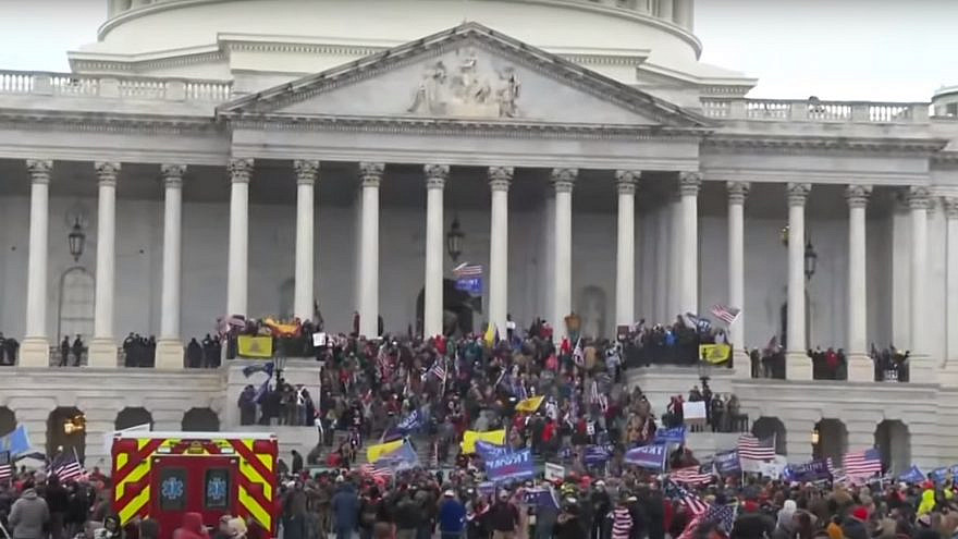 Supporters of President Donald Trump at the U.S. Capitol, where hundreds smashed windows and broke into the building while protesting the results of the November elections, Jan. 6, 2021. Source: YouTube.
