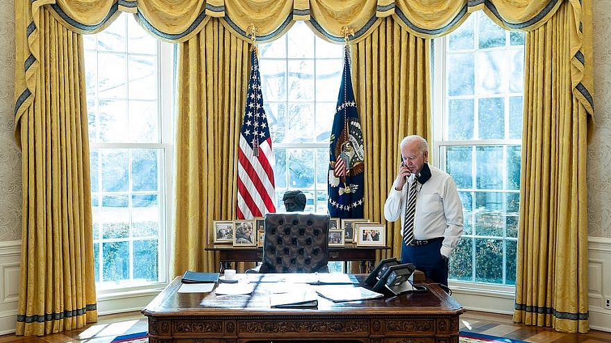 U.S. President Joe Biden talks on the phone with Mexico’s President Andrés Manuel López Obrador in the Oval Office of the White House on Jan. 22, 2021. Credit: Official White House Photo by Adam Schultz.