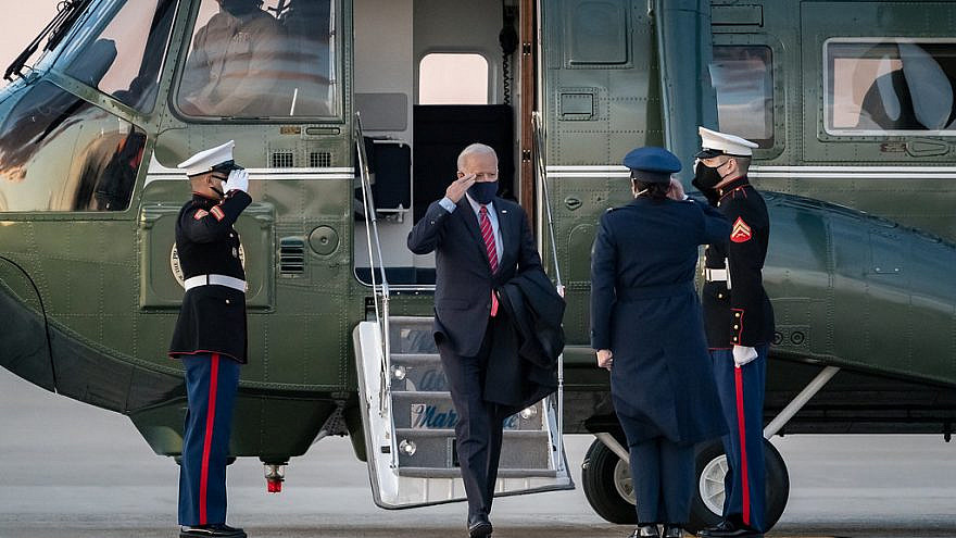 U.S. President Joe Biden salutes as he disembarks Marine One at Joint Base Andrews, Md., prior to boarding Air Force One to begin his flight to New Castle County Airport in New Castle, Del., on Feb. 5, 2021. Credit: Official White House Photo by Carlos Fyfe.