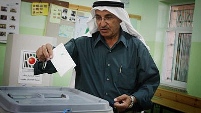 A Palestinian Arab man casts his vote in the municipal elections in the West Bank town of Al-Bireh on Oct. 20, 2012. Photo by Issam Rimawi/Flash90.
