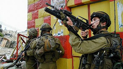 IDF soldiers in the Jenin refugee camp during "Operation Defensive Shield," April 9, 2002. Credit: IDF Spokesperson's Office.