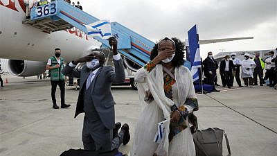 Ethiopian immigrants arrive at Ben-Gurion International Airport on the final flight of “Operation Tzur Israel” on March 11, 2021. Photo by Olivier Fitoussi.