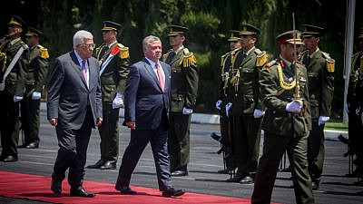 Palestinian Authority leader Mahmoud Abbas and Jordanian King Abdullah II review an honor guard in Ramallah, Aug. 7, 2017. Credit: Flash90.