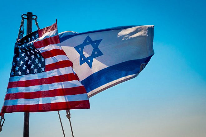 American and Israeli flags flying together. Credit: John Theodor/Shutterstock.