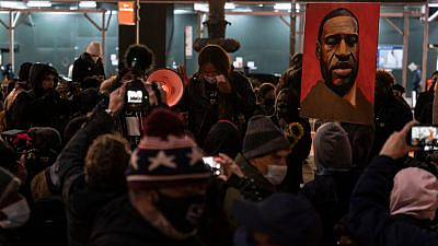 Protesters rally and march in Bryant Park, N.Y., on the first day of the trial of Minneapolis police officer Derek Chauvin, accused of killing African-American George Floyd on May 25, 2020. Credit: Lev Radin/Shutterstock.