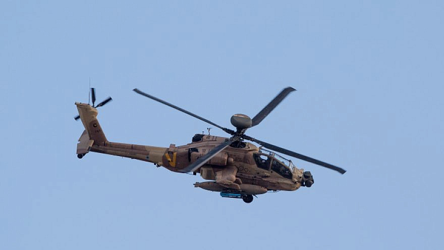 An IAF Apache attack helicopter at an aerial show in honor of an IAF Flight Course graduation ceremony at the Hatzerim Air Base in the Negev, Dec. 29, 2016. Photo by Miriam Alster/Flash90.