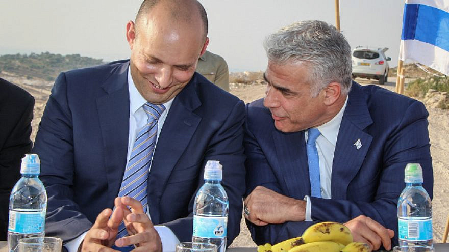 Knesset Member Yair Lapid and Education Minister Naftali Bennett in the Netiv Avot neighborhood in Gush Etzion, on July 23, 2017. Photo by Gershon Elinson/Flash90.