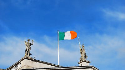 An Irish flag flying over Dublin. Photo by David Renton/Shutterstock.