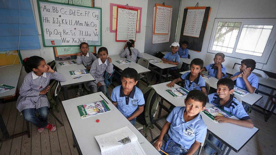 Palestinian students attend the opening of the academic year at the Khan al-Ahmar school near Jerusalem on Aug. 17, 2016. Credit: Flash90.