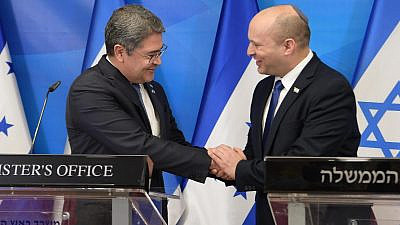Israeli Prime Minister Naftali Bennett greets Honduran President Juan Orlando Hernandez at the Prime Minister's Office in Jerusalem prior to dedicating the Honduran Embassy in the city, June 23, 2021. Photo by Amos Ben-Gershom/GPO.