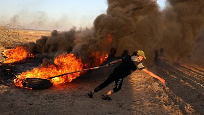 Palestinians in the Gaza Strip burn tires and send incendiary devices across the border with southern Israel, on June 15, 2021. Photo by Abed Rahim Khatib/Flash90.