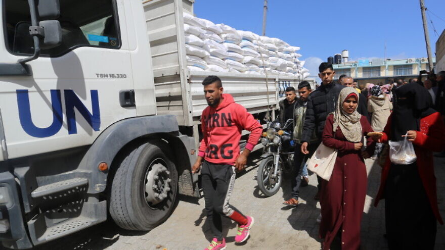 Palestinians come to receive food aid from a UNRWA distribution center in the Khan Yunis camp in the southern Gaza Strip, March 7, 2020. Photo by Fadi Fahd/Flash90.