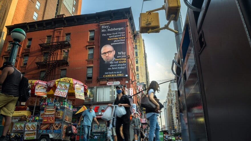 A billboard with the photo of “New York Times” publisher A.G. Sulzberger has been erected outside the newspaper’s headquarters at 620 Eighth Aven. in New York City, August 2021. Credit: CAMERA.