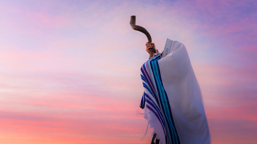 A man blowing a shofar. Credit: John Theodor/Shutterstock.
