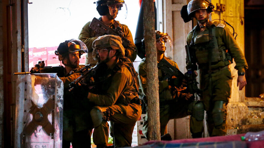 Israeli troops confront Palestinian rioters in Hebron, protesting on behalf of the six terrorists who escaped the Gilboa Prison, Sept. 8, 2021. Photo by Wisam Hashlamoun/Flash90.