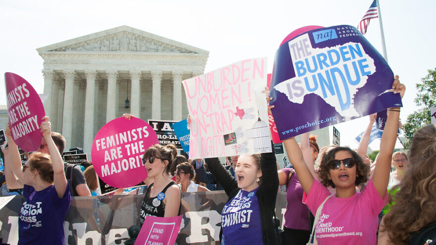 Pro-choice activists in front of the U.S. Supreme Court. Credit: Rena Schild/Shutterstock.