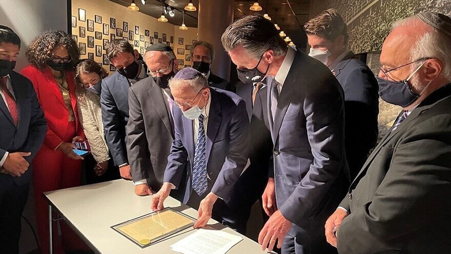 California Gov. Gavin Newsom views “The Hitler Letter” with members of the California Jewish Caucus, state legislators and (from left) Simon Wiesenthal Center executive director Meyer H. May, Simon Wiesenthal Center founder and CEO Rabbi Marvin Hier (center) and Rabbi Abraham Cooper, Simon Wiesenthal Center associate dean and global social action director, Oct. 6, 2021. Credit: Courtesy.
