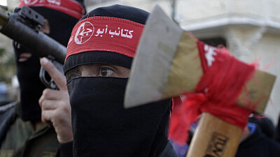 Members of the Popular Front for the Liberation of Palestine (PFLP) take part in a military show in Khan Younis in the southern Gaza Strip to celebrate the 47th anniversary of the group's founding, Dec. 11, 2014. Photo by Abed Rahim Khatib/Flash90.