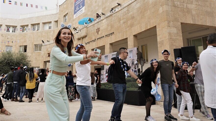 New immigrants to Israel dance the hora in Jerusalem. Credit: Zug Productions for the Jewish Agency.