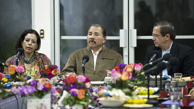 Daniel Ortega, president of Nicaragua, receives an Ecuadorian delegation in August 2013. Photo by Fernanda LeMarie/Foreign Ministry of Ecuador via Wikimedia Commons.