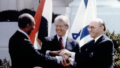 Egyptian President Anwar Sadat, U.S. President Jimmy Carter and Israeli Prime Minister Menachem Begin at the peace-treaty signing between Israel and Egypt on the White House lawn, March 26, 1979. Credit: GPO.
