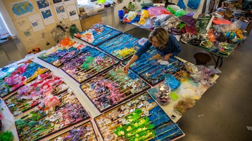 Artist Beverly Barkat works on "Earth Poetica" in her Jerusalem studio. Photo: Caroline Shapiro.