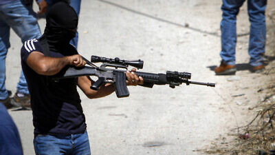 Palestinian gunmen from the Al-Aqsa Martyrs Brigades at the funeral of Malek Hamdan in the village of Salem near Nablus, May 15, 2021. Photo by Nasser Ishtayeh/Flash90.