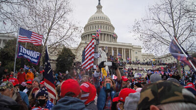 The U.S. Capitol in Washington during the Jan. 6, 2021, attack on the building. Photo by Tyler Merbler via Wikimedia Commons.