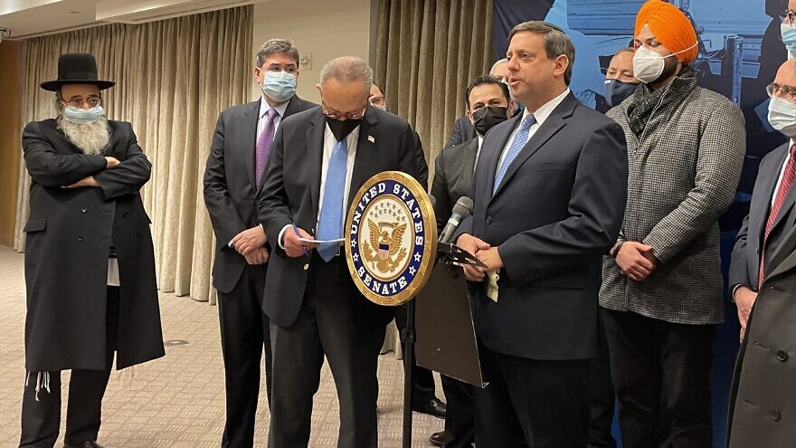 Nathan Diament, the Orthodox Union's executive director of public policy, speaks alongside Senate Majority Leader Chuck Schumer at a New York City press conference calling for an increase in funding for the Nonprofit Security Grant Program to $360 million, so more synagogues, other houses of worship and nonprofits at risk of attack can improve building security, Jan. 26, 2022. Credit: Orthodox Union.