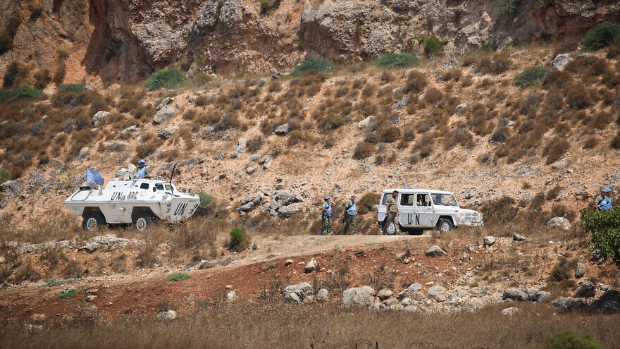 U.N. peacekeepers associated with UNIFIL patrol the border between Israel and Lebanon as seen from Metula in northern Israel, Aug. 27, 2019. Photo by David Cohen/Flash90.