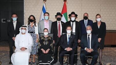 Israeli President Isaac Herzog meets with Jewish leaders in Abu Dhabi. Top row (right to left): Yifat Turbiner, Steve Benchimol, Rabbi Levi Duchman, Rabbi Eli Abadi, Daniel Seal, Sarah Benchimol, and Ross Kriel. Bottom row (right to left): Israeli Ambassador in the UAE Amir Hayek, Herzog, first lady Michal Herzog, and UAE Ambassador in Israel Mohamed Al Khaja. Credit: Amos Ben-Gershom/GPO