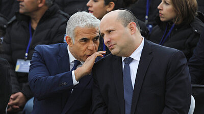 Then-Prime Minister Naftali Bennett and Foreign Minister Yair Lapid at Ben-Gurion Airport, March 21, 2022. Credit: Marc Israel Sellem/POOL.