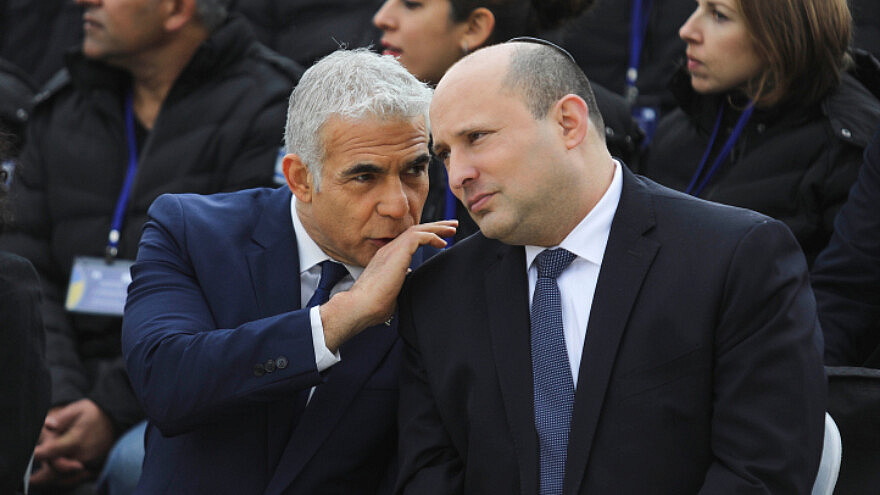 Then-Prime Minister Naftali Bennett and Foreign Minister Yair Lapid at Ben-Gurion Airport, March 21, 2022. Credit: Marc Israel Sellem/POOL.