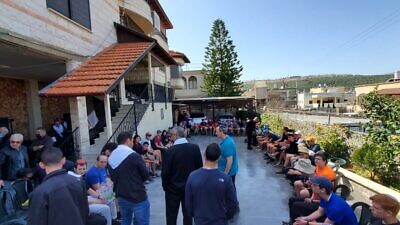 A group of students from the Derech Avot High School of Ohr Torah Stone educational network in Efrat visited the home of a Druze police officer, 19-year-old Yazan Falah, who was killed in a terror attack in Hadera on March 27, 2022. Credit: Courtesy of Ohr Torah Stone.