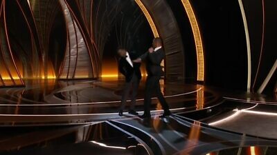 Actor Will Smith slaps Chris Rock, fellow actor, comedian and host of the 94th Academy Awards in Los Angeles on March 27, 2022. Source: Screenshot.