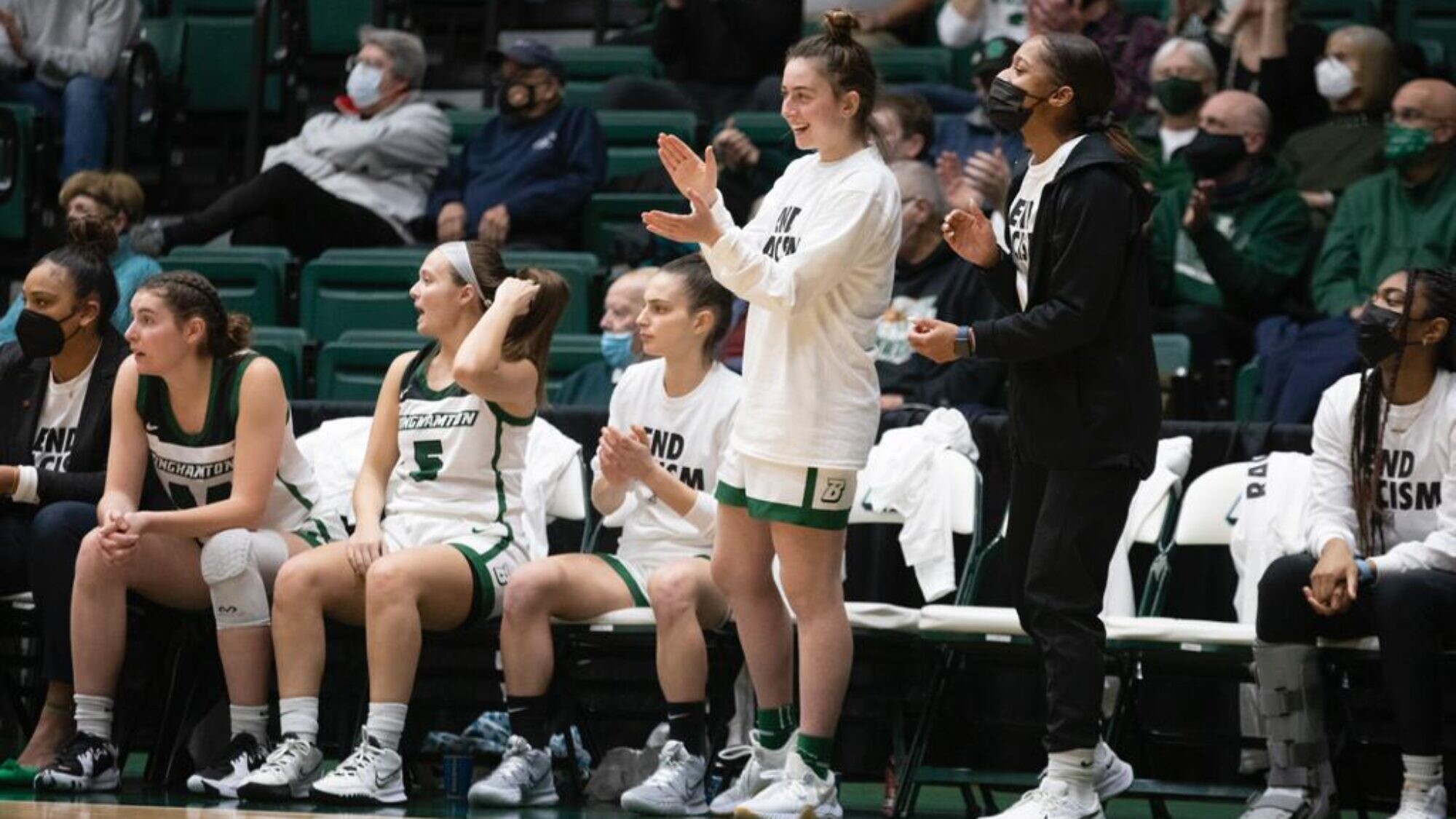 Mia Raskin (standing) at a Binghamton University game. Credit: Courtesy.