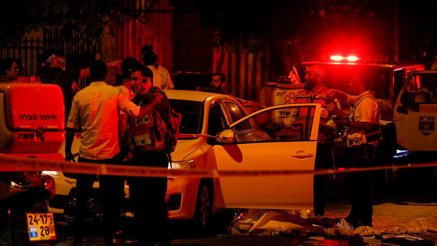 Israeli security and rescue personnel at the scene of a terrorist attack on Ibn Gvirol Street in Elad, east of Tel Aviv and near the city of Petach Tikvah, on Yom Ha'azmaut, Israel's Independence Day, May 5, 2022. Photo by Jamal Awad/Flash90.