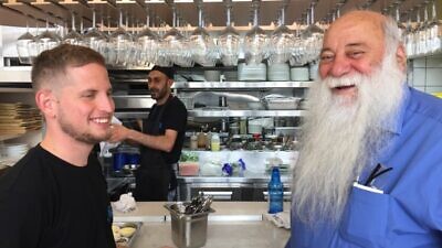Uri Jeremais with his grandson Omer Cohen, who works at Uri Buri restaurant. Photo by Diana Bletter.