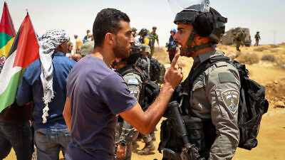 Palestinians clash with Israeli forces during a protest in Masafer Yatta, south of Hebron, on June 17, 2022. Photo By Wisam Hashlamoun/Flash90.
