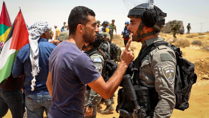 Palestinians clash with Israeli forces during a protest in Masafer Yatta, south of Hebron, on June 17, 2022. Photo By Wisam Hashlamoun/Flash90.