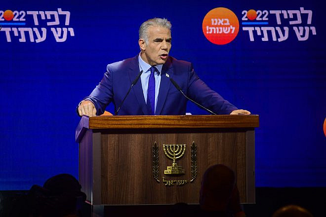 Prime Minister and Yesh Atid chairman Yair Lapid speaks to party members during a Yesh Atid party conference in Tel Aviv, August 3, 2022. Photo by Avshalom Sassoni/Flash90