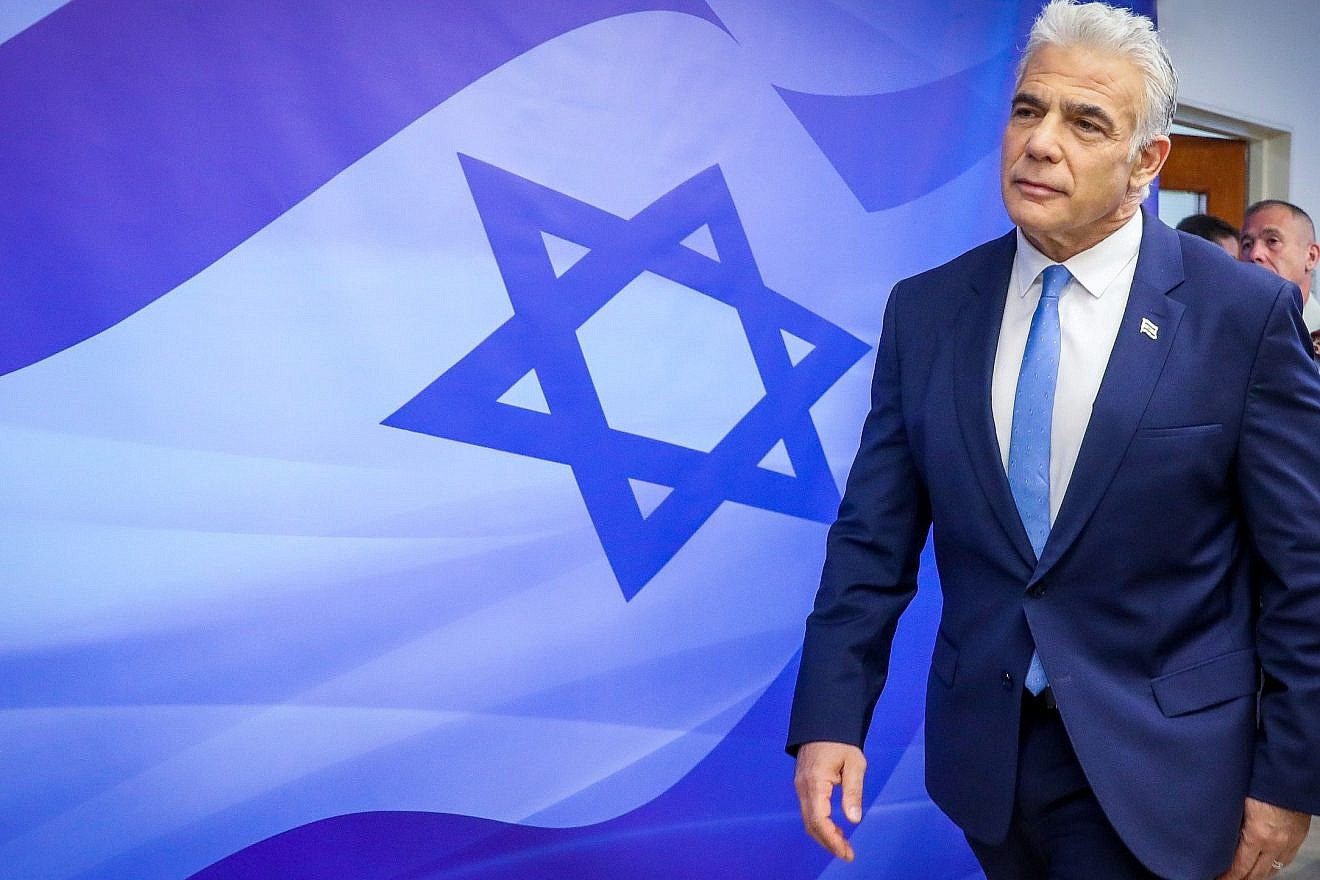 Israeli Prime Minister Yair Lapid arrives for a cabinet meeting in Jerusalem, July 31, 2022. Credit: Marc Israel Sellem/POOL.