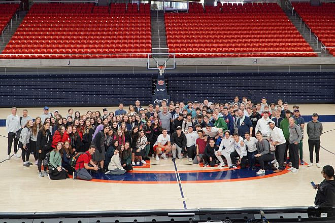 NCSY participants at the Auburn Tigers' court, with Coach Bruce Pearl in center. Credit: NCSY.