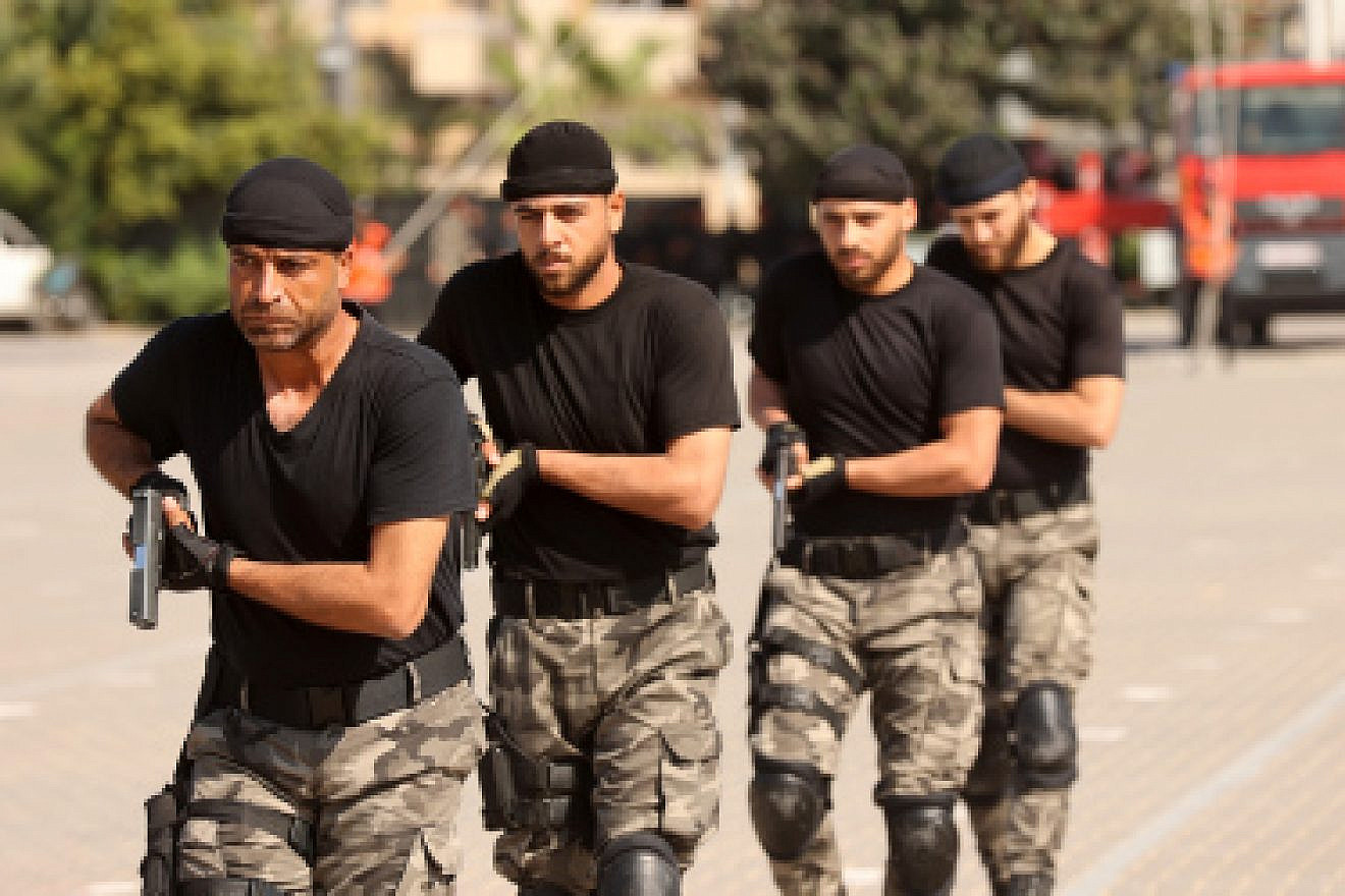 Hamas security personnel display their skills during a police academy graduation ceremony in Gaza City, Oct. 31, 2022. Photo by Attia Muhammed/Flash90.