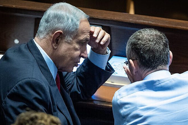 Likud Party chairman MK Benjamin Netanyahu with Likud MK Yariv Levin in the Knesset assembly hall on Nov. 21, 2022. Photo by Yonatan Sindel/Flash90.