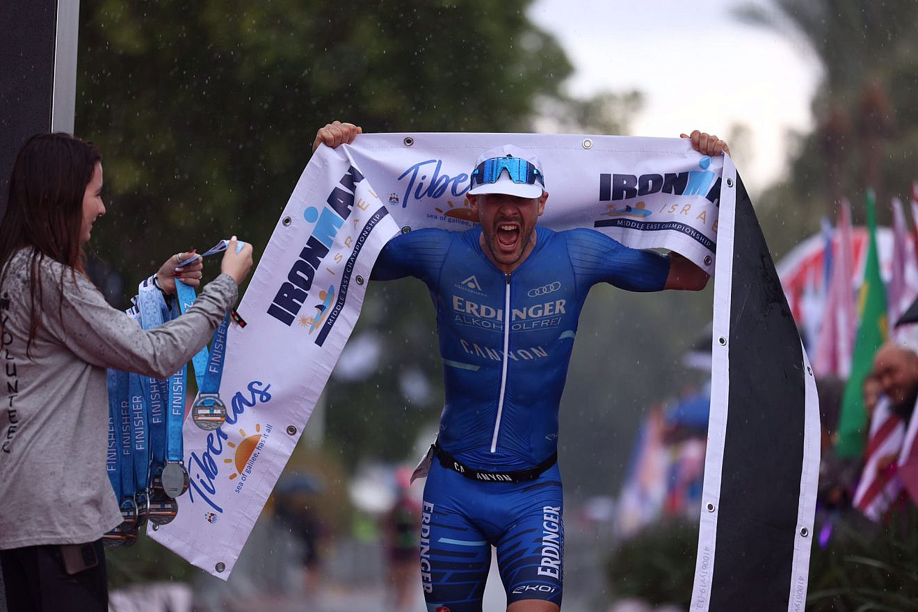 Patrick Lange of Germany won the title of
"IRONMAN Israel-Middle East Champion," Nov. 25, 2022. Photo by Gilad Kavalerchik, Ronen Topelberg.