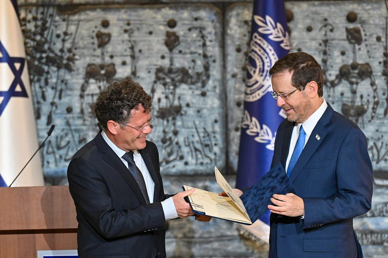 Israeli President Isaac Herzog (right) receives the official results of the country's Nov. 1 national elections from Central Elections Committee chairman Justice Yitzhak Amit, Nov. 9, 2022. Photo by Kobi Gideon/GPO.
