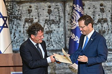 Israeli President Isaac Herzog (right) receives the official results of the country's Nov. 1 national elections from Central Elections Committee chairman Justice Yitzhak Amit, Nov. 9, 2022. Photo by Kobi Gideon/GPO.