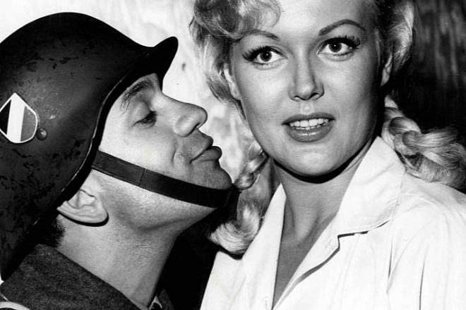 Robert Clary as Lebeau and Cynthia Lynn as Fräulein Helga from the television program "Hogan's Heroes," 1965. Source: Wikimedia Commons.